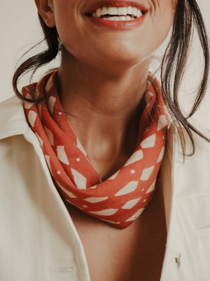 SUNDAY/MONDAY's hand block printed Domino bandana is printed with natural red dye on a super soft silk cotton blend.
