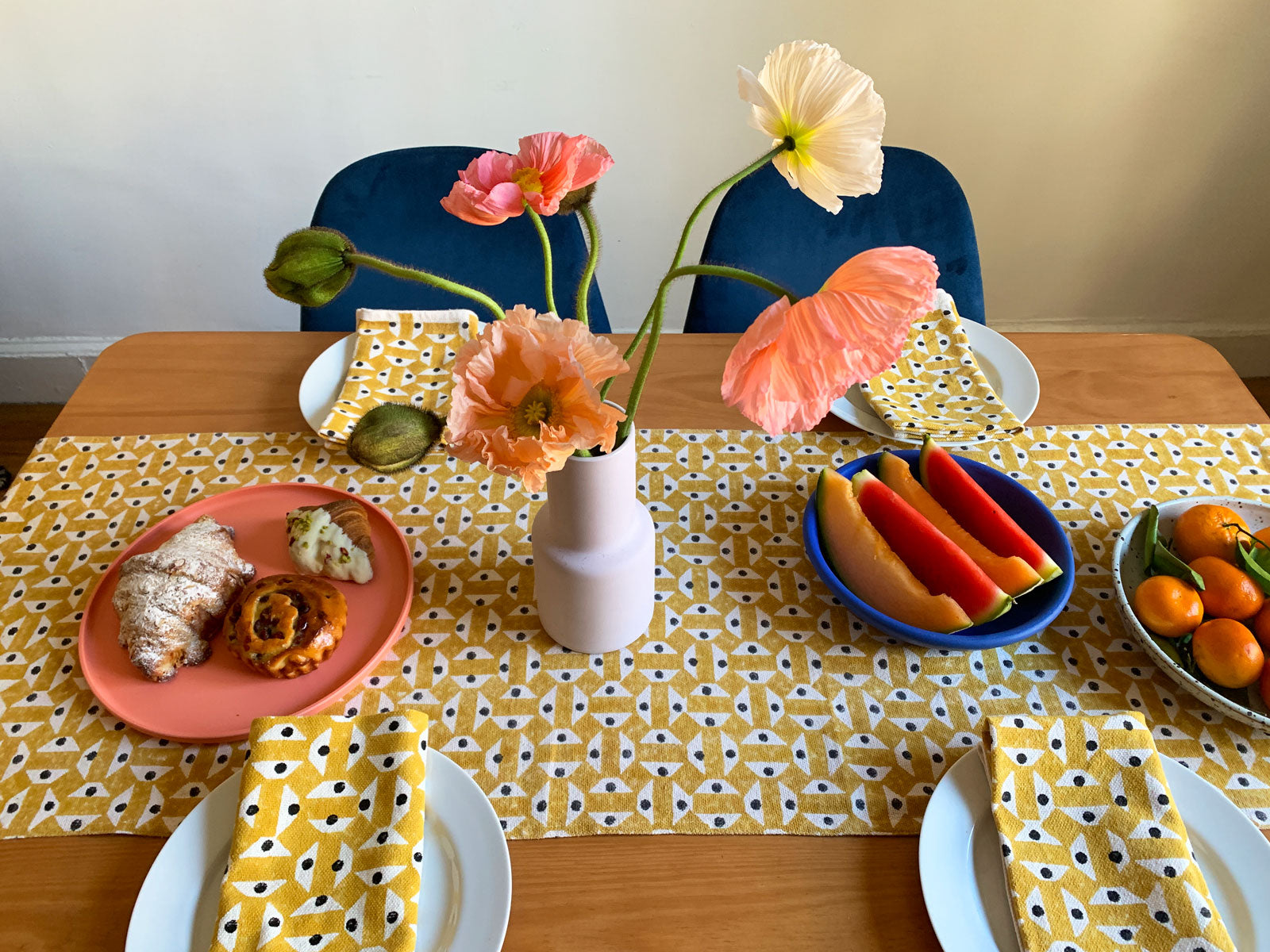 Yellow and black geometric patterned table runner and napkins by SUNDAY/MONDAY.  Hand block printed in India. Perfect table linens for spring and summer in a cheery chic yellow.